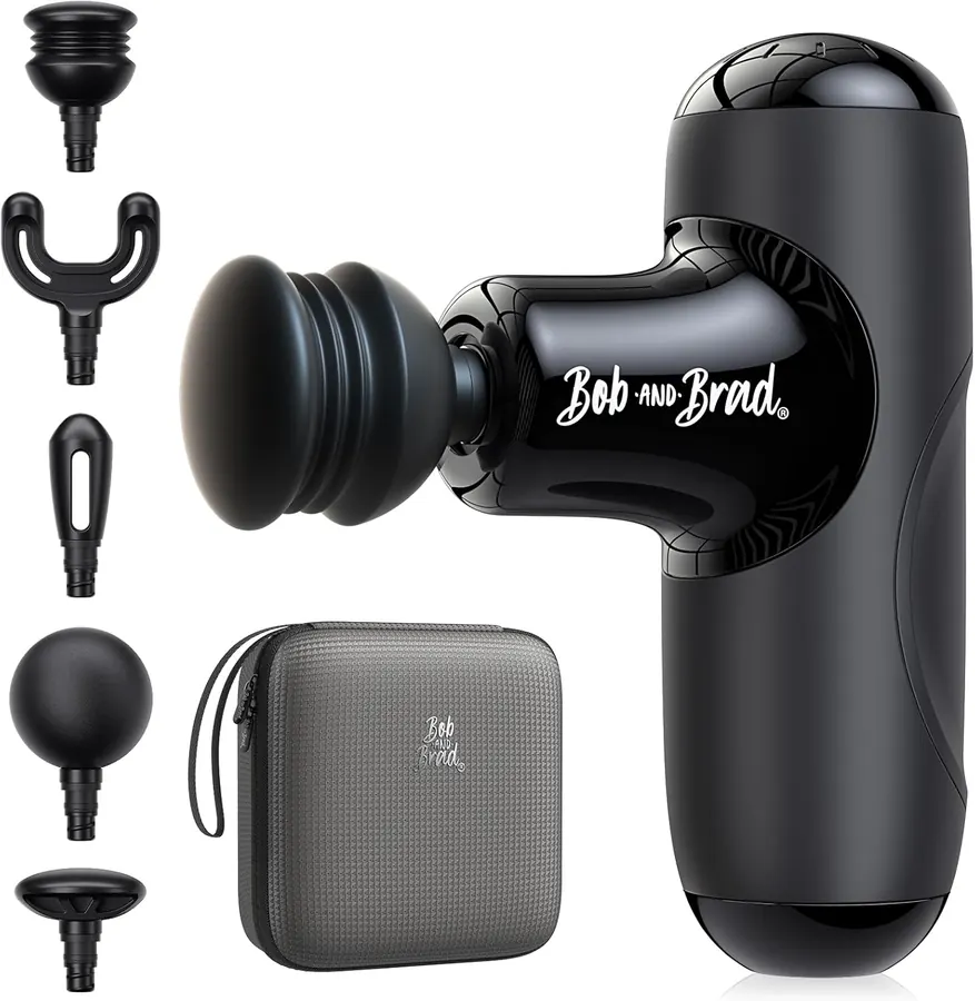 Close-up of the BOB AND BRAD Q2 Mini massage gun resting on a folded gym towel next to a water bottle