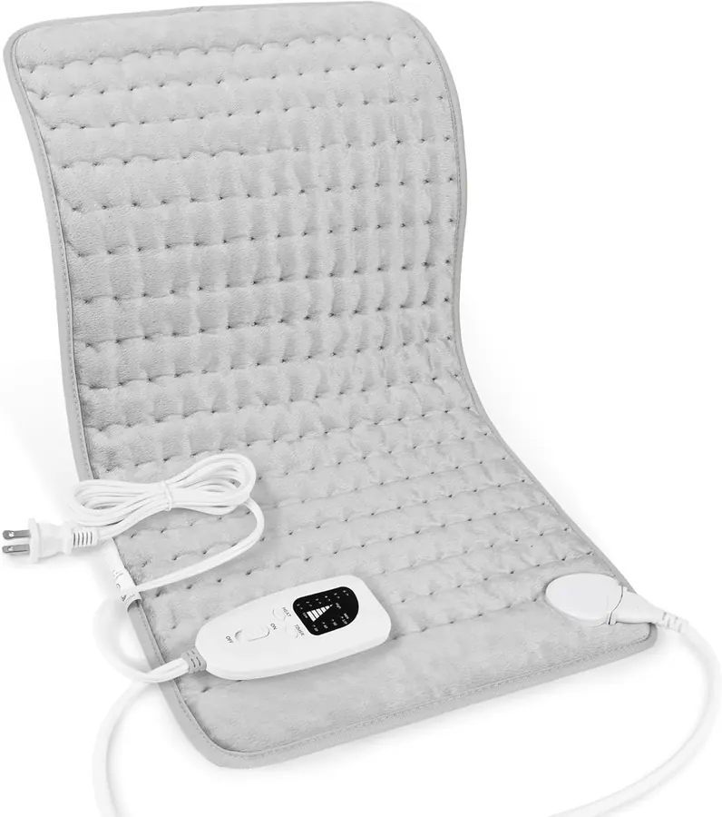 Person placing the Deepsoon heating pad against their lower back while seated in a chair