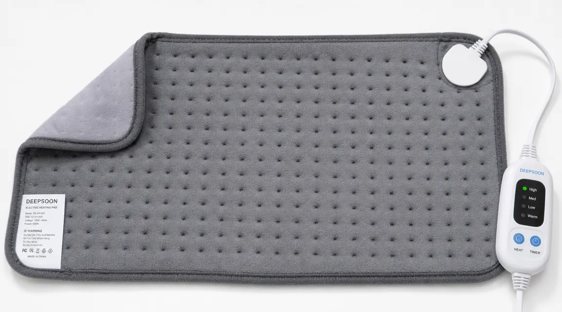 Close-up of Deepsoon heating pad laid flat on a table showing moist heat dampened fabric insert