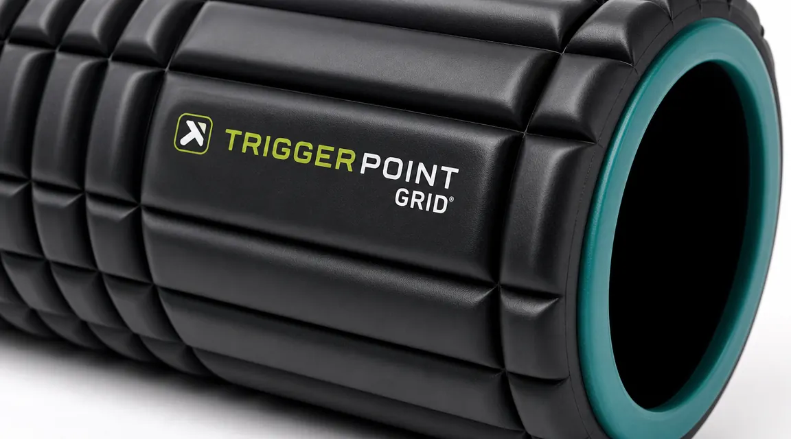 Close-up of multi-density foam roller surface texture showing three grid zones